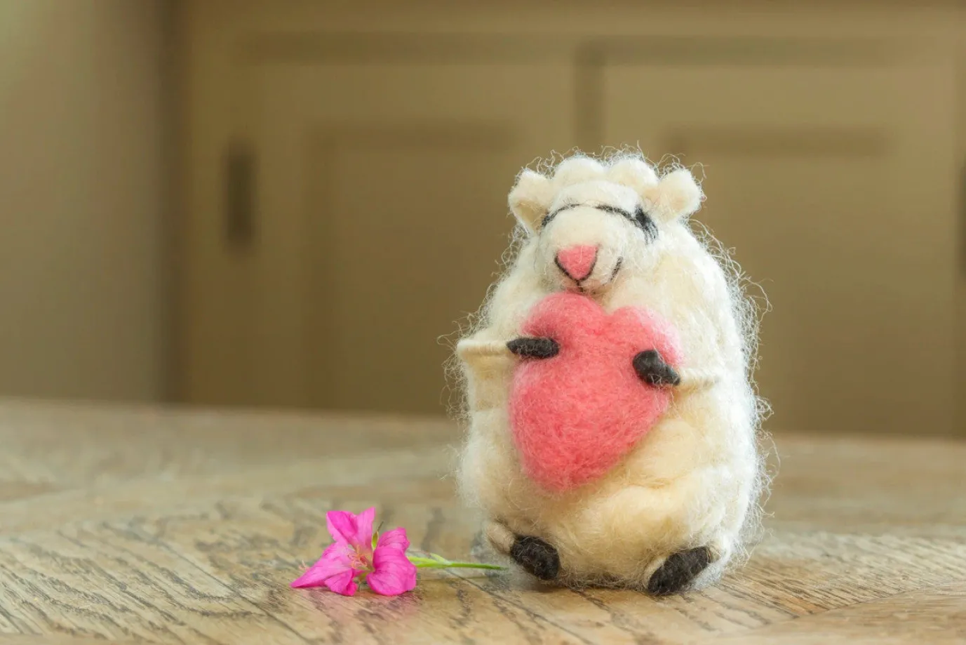 Loving Lottie Sheep Holding a Heart